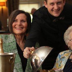 Nora returns to roots as silver service waitress